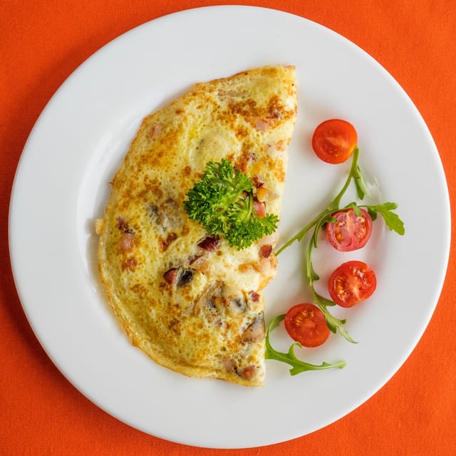Bacon Cheddar Tomato Omelette.